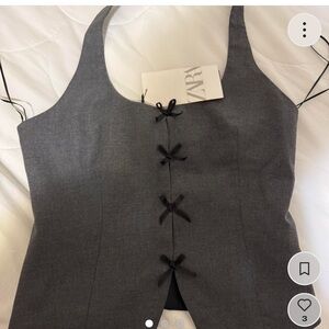 Zara top- grey vest with black bows